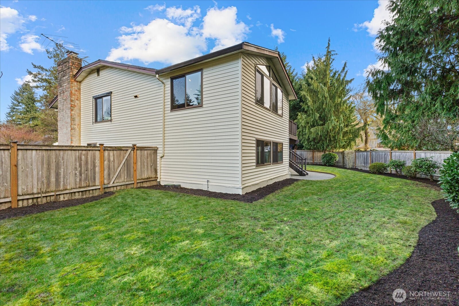 12121 Northeast 161st Street Bothell, WA 98011 - Photo 18 of 22 a view of a house with backyard