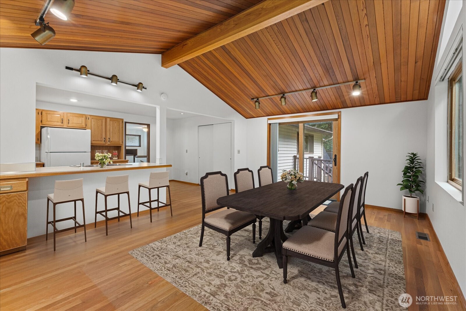 12121 Northeast 161st Street Bothell, WA 98011 - Photo 6 of 22 a view of a dining room with furniture and wooden floor