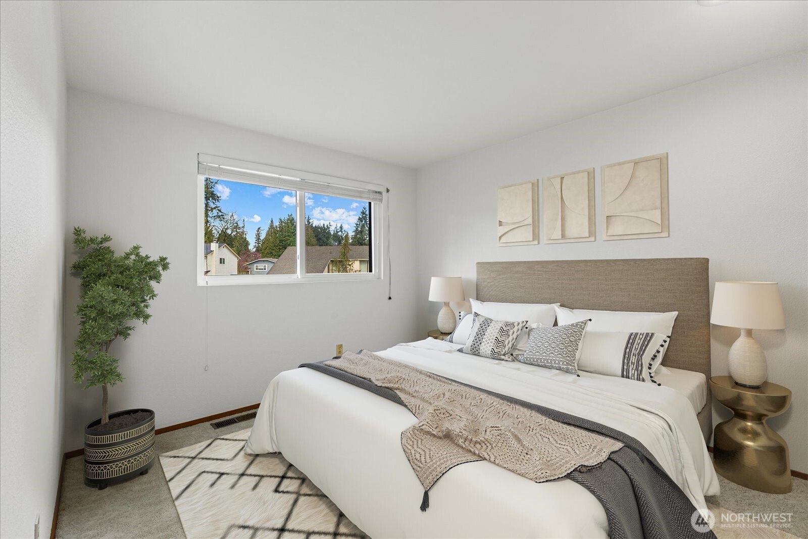 12121 Northeast 161st Street Bothell, WA 98011 - Photo 10 of 22 a bedroom with a bed and a potted plant
