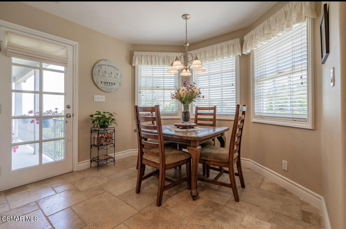 1029 Alta Vista Road Simi Valley, CA 93063 - Photo 11 of 20 a view of a dining room with furniture window and wooden floor