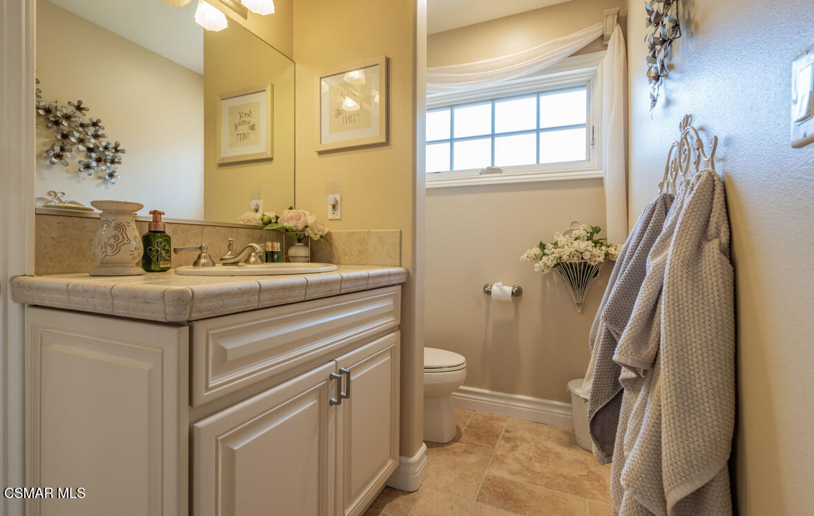 1029 Alta Vista Road Simi Valley, CA 93063 - Photo 12 of 20 a bathroom with a sink and a mirror