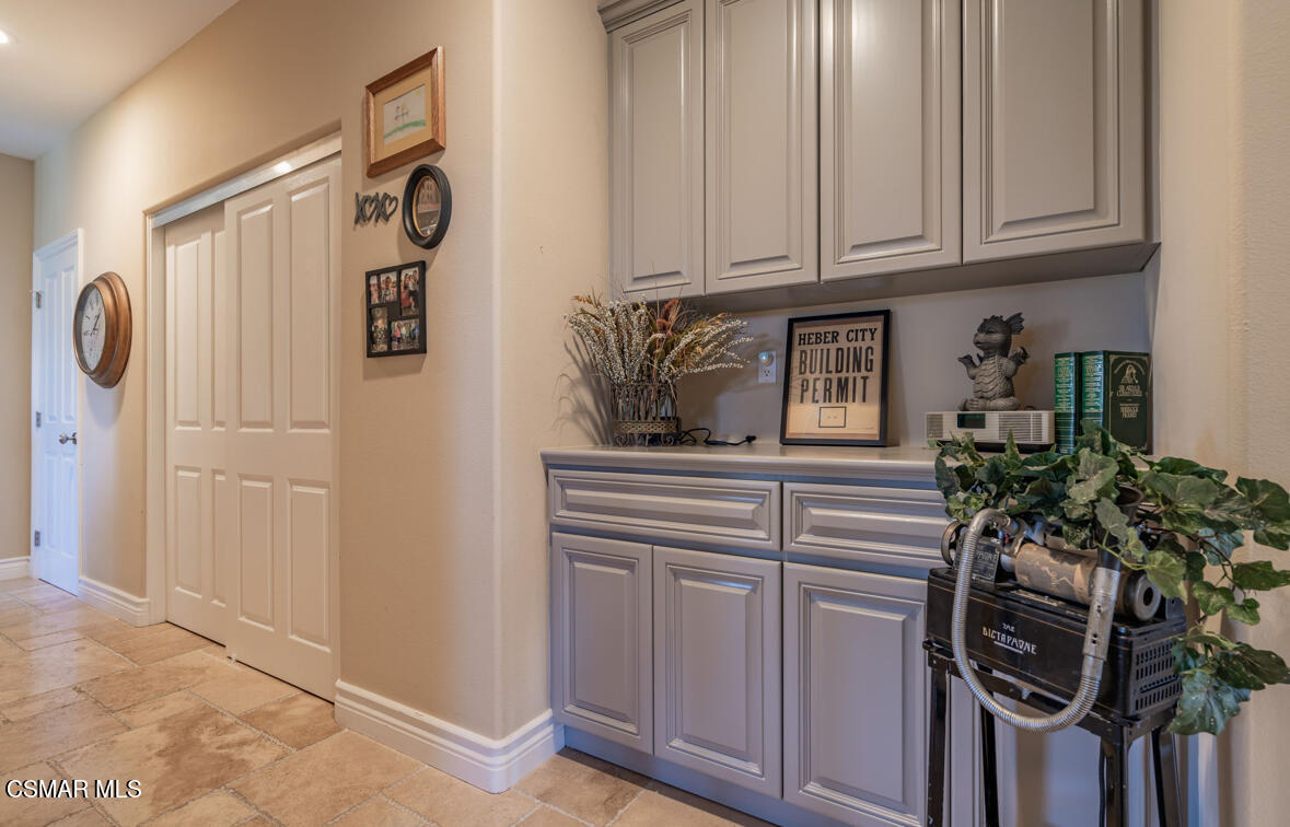 1029 Alta Vista Road Simi Valley, CA 93063 - Photo 15 of 20 a kitchen with a refrigerator and cabinets