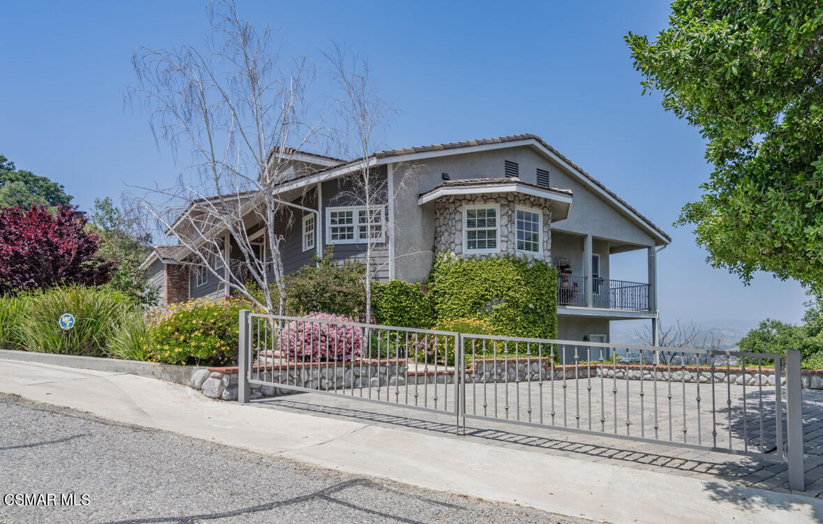 1029 Alta Vista Road Simi Valley, CA 93063 - Photo 17 of 20 a front view of a house with a garden