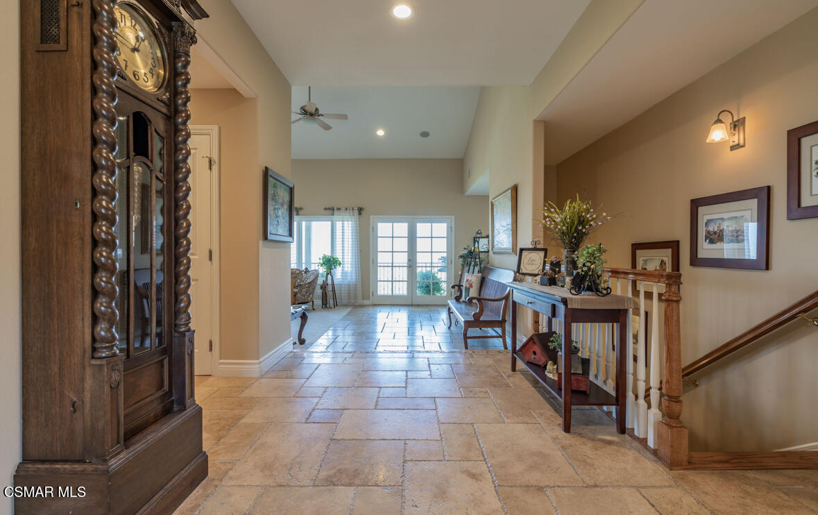 1029 Alta Vista Road Simi Valley, CA 93063 - Photo 3 of 20 a view of a hallway with dining area and chandelier