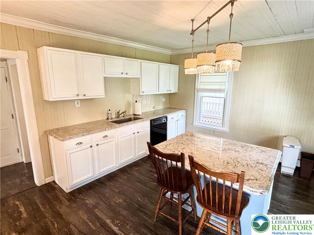 7241 Decatur Street New Tripoli, PA 18066 - Photo 2 of 36 A well-appointed kitchen showcasing elegant granite countertops and modern appliances.