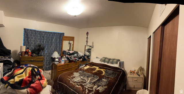 3977 Rivendell Road, Unit AB Taylorsville, UT 84129 - Photo 8 of 14 Bedroom featuring a textured ceiling