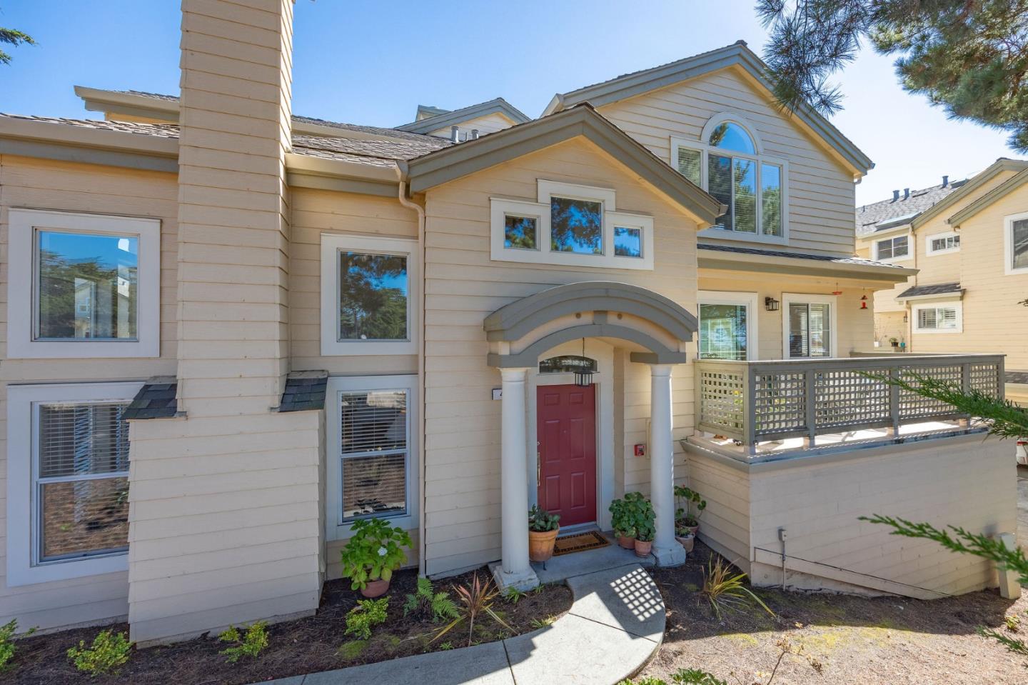 a front view of a house with garden