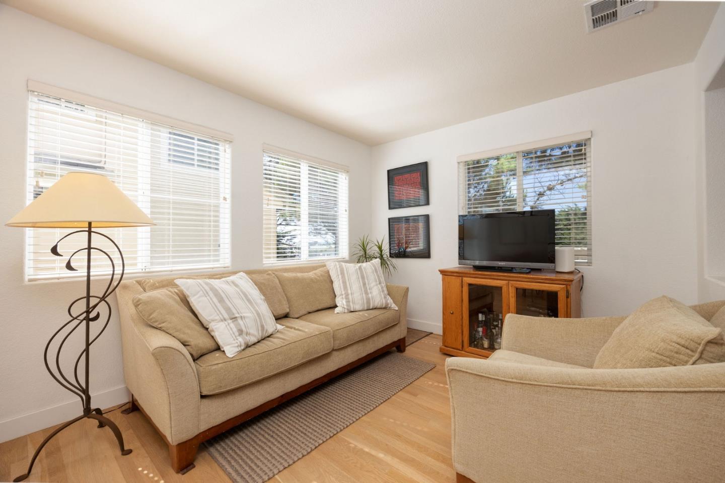 40 Patrick Way Half Moon Bay, CA 94019 - Photo 18 of 39 a living room with furniture and a flat screen tv