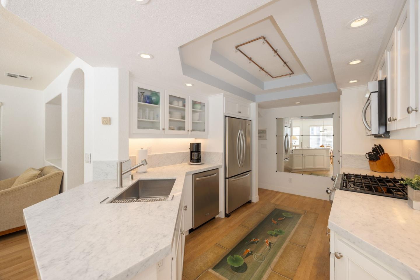 40 Patrick Way Half Moon Bay, CA 94019 - Photo 20 of 39 a kitchen with stainless steel appliances granite countertop a sink stove and refrigerator