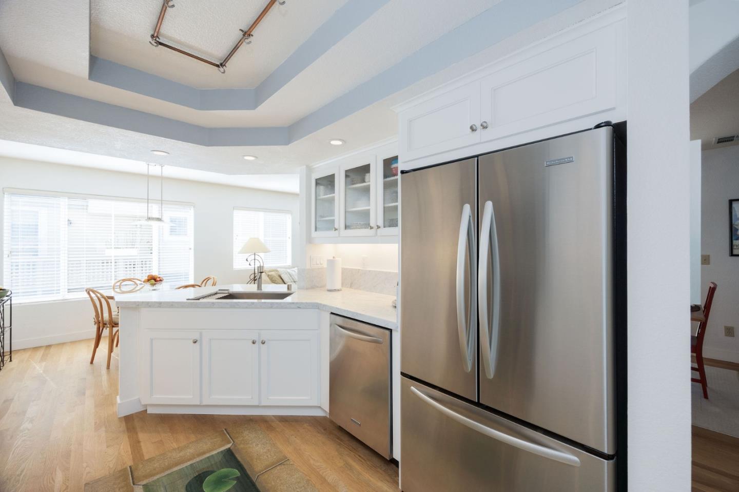 40 Patrick Way Half Moon Bay, CA 94019 - Photo 22 of 39 a kitchen with stainless steel appliances granite countertop a refrigerator and a stove top oven