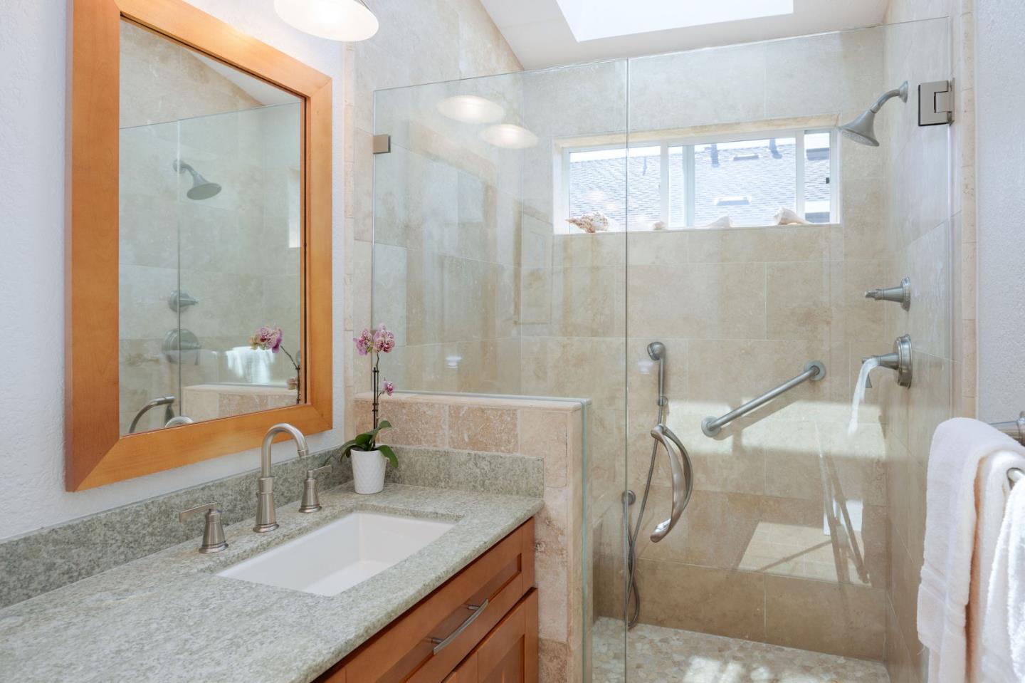 40 Patrick Way Half Moon Bay, CA 94019 - Photo 31 of 39 a bathroom with a granite countertop sink mirror and double