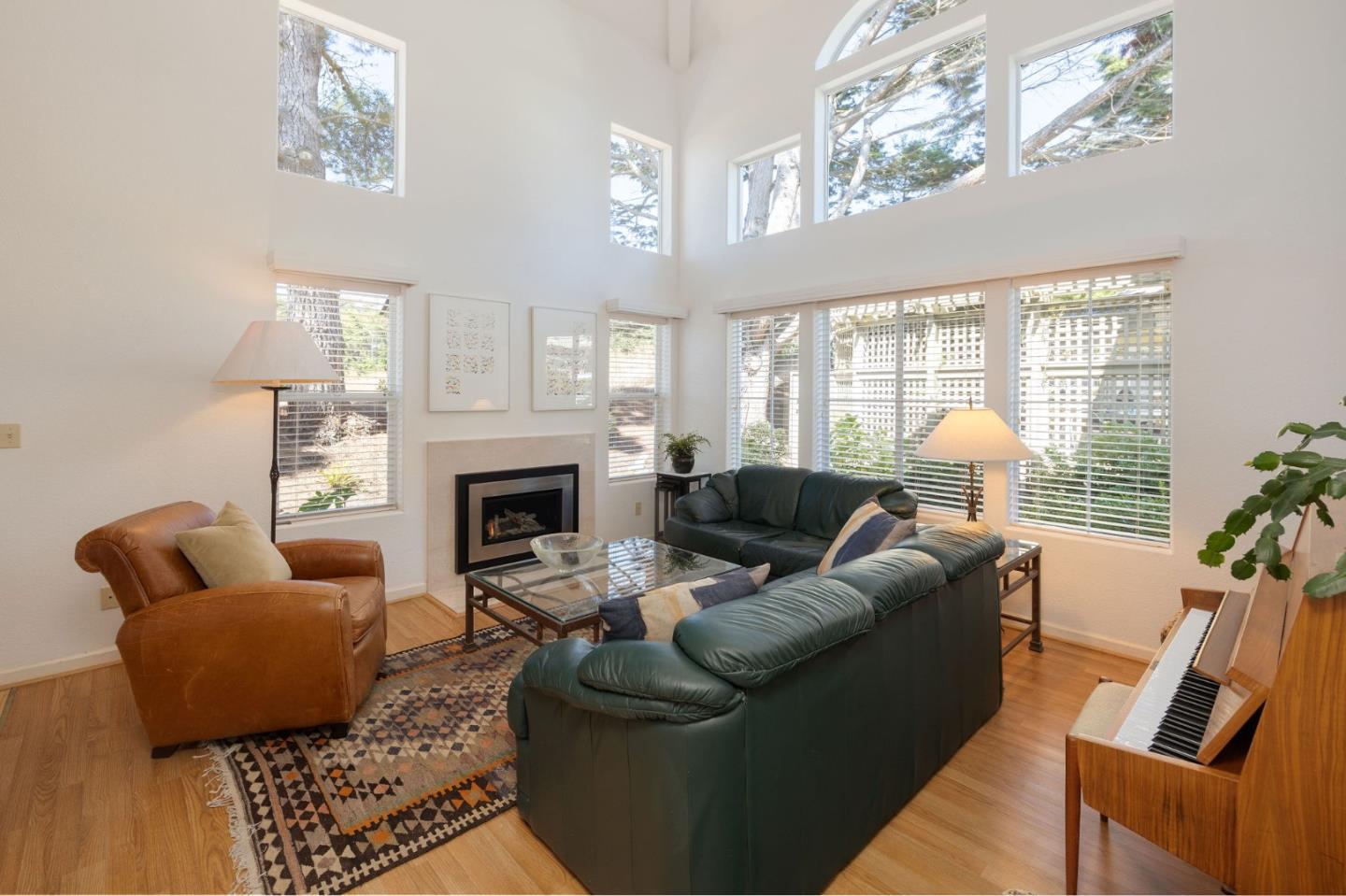 40 Patrick Way Half Moon Bay, CA 94019 - Photo 6 of 39 a living room with furniture a large window and a fireplace