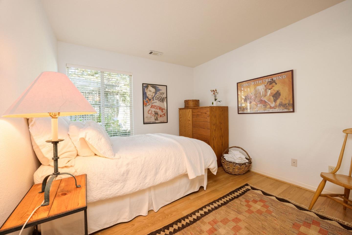 40 Patrick Way Half Moon Bay, CA 94019 - Photo 9 of 39 a bedroom with a bed and wooden floor