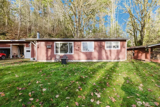 a view front of house with backyard and trees