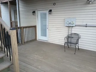 a view of a patio with a table and chairs