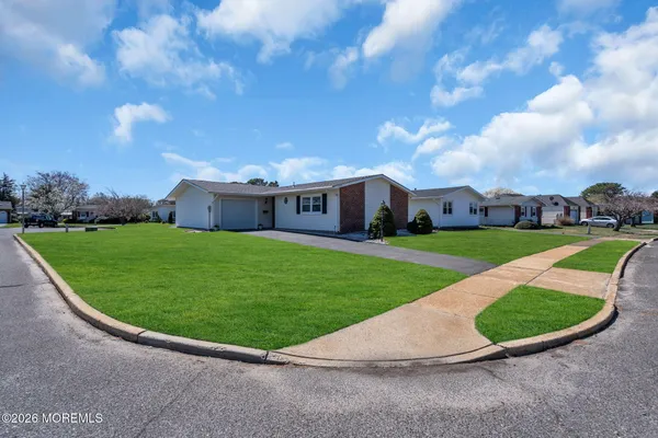 a view of a house with a big yard