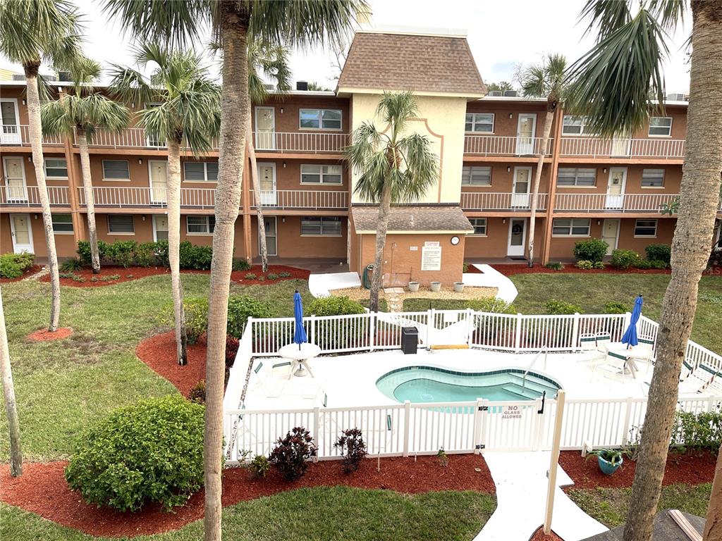 a view of a patio with swimming pool