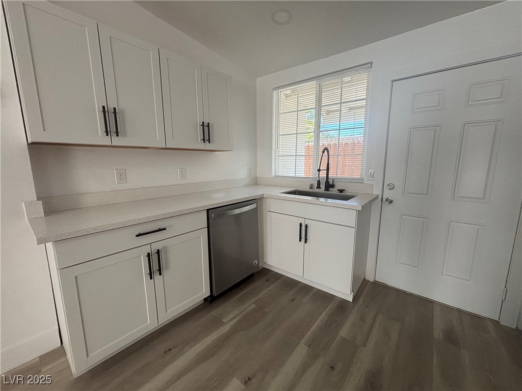 724 North 9th Street, Unit 2 Las Vegas, NV 89101 - Photo 5 of 10 Kitchen with white cabinets, dishwasher, dark wood-style flooring, and light stone counters