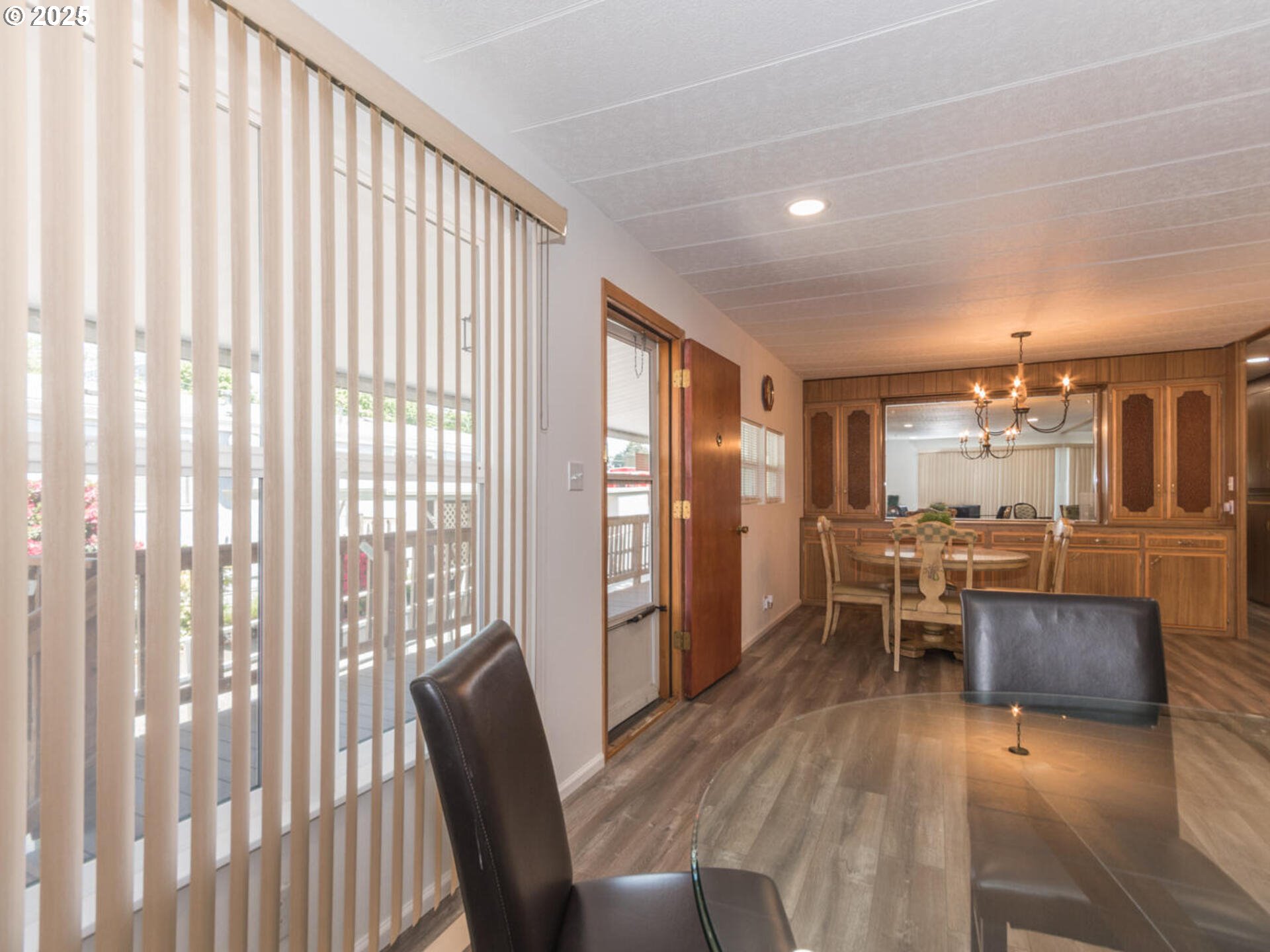 21016 Southeast Stark Street, Unit 69 Gresham, OR 97030 - Photo 12 of 43 a view of a dining room with furniture window and wooden floor