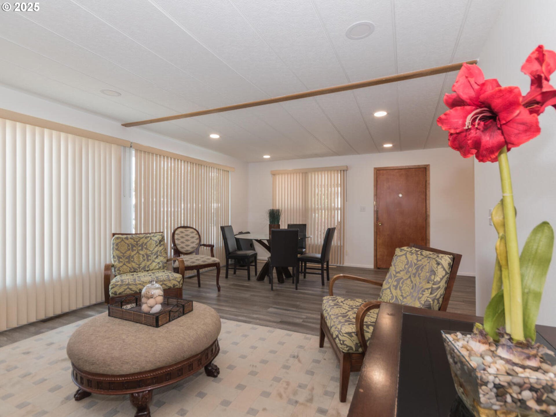 21016 Southeast Stark Street, Unit 69 Gresham, OR 97030 - Photo 16 of 43 a living room with furniture and a chandelier