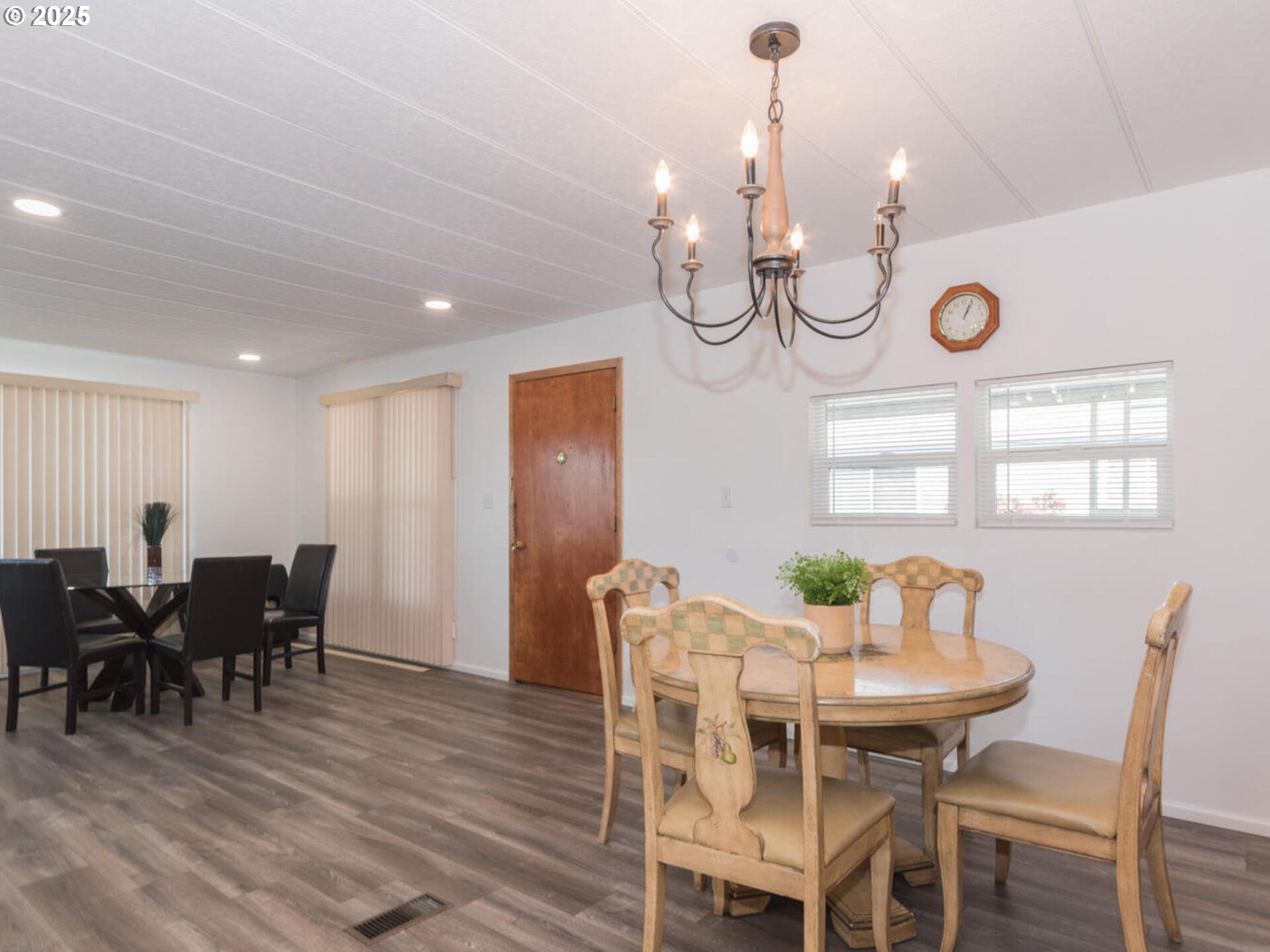 21016 Southeast Stark Street, Unit 69 Gresham, OR 97030 - Photo 28 of 43 a view of a dining room with furniture and chandelier