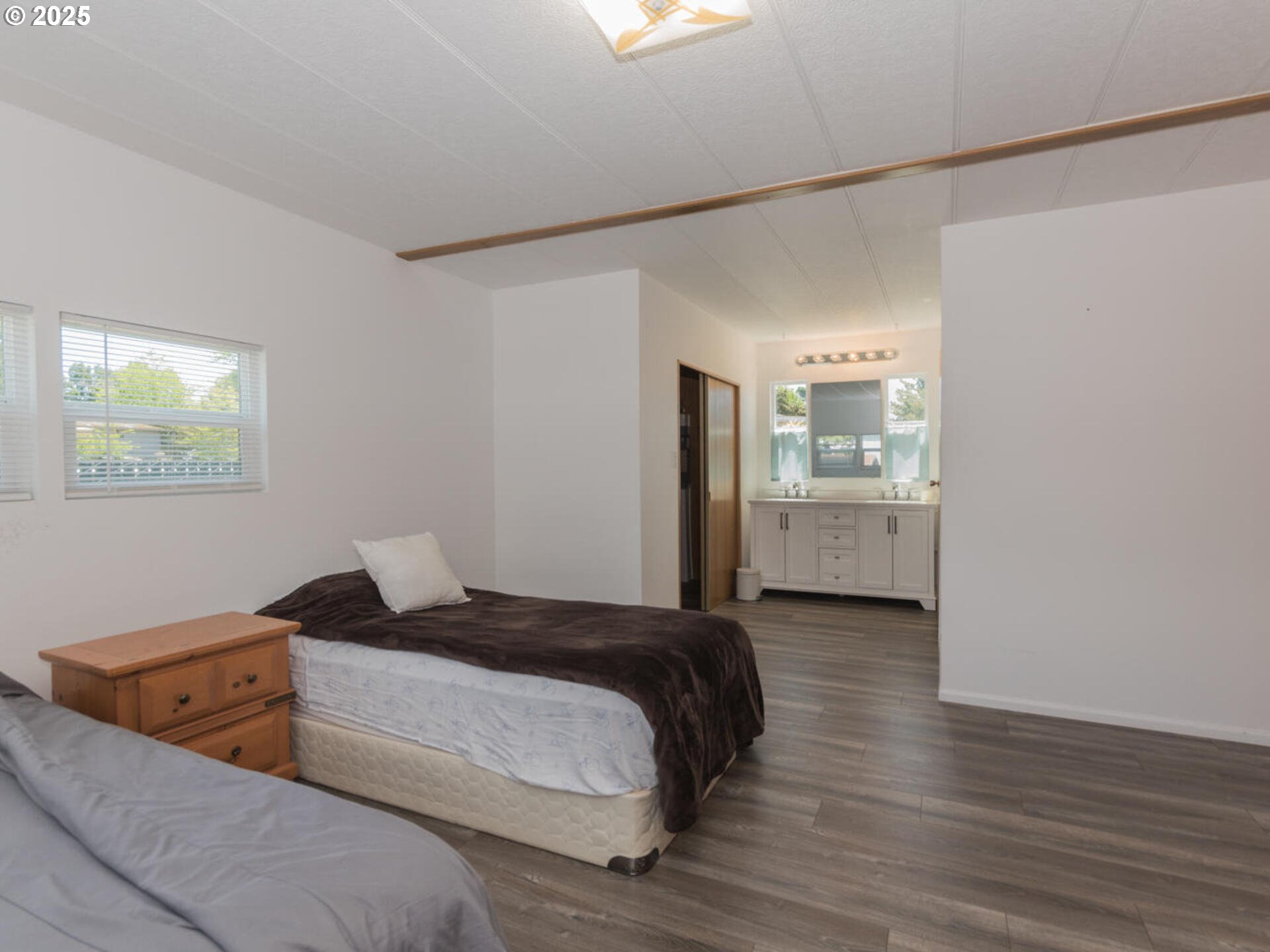 21016 Southeast Stark Street, Unit 69 Gresham, OR 97030 - Photo 32 of 43 a bedroom with a bed and window