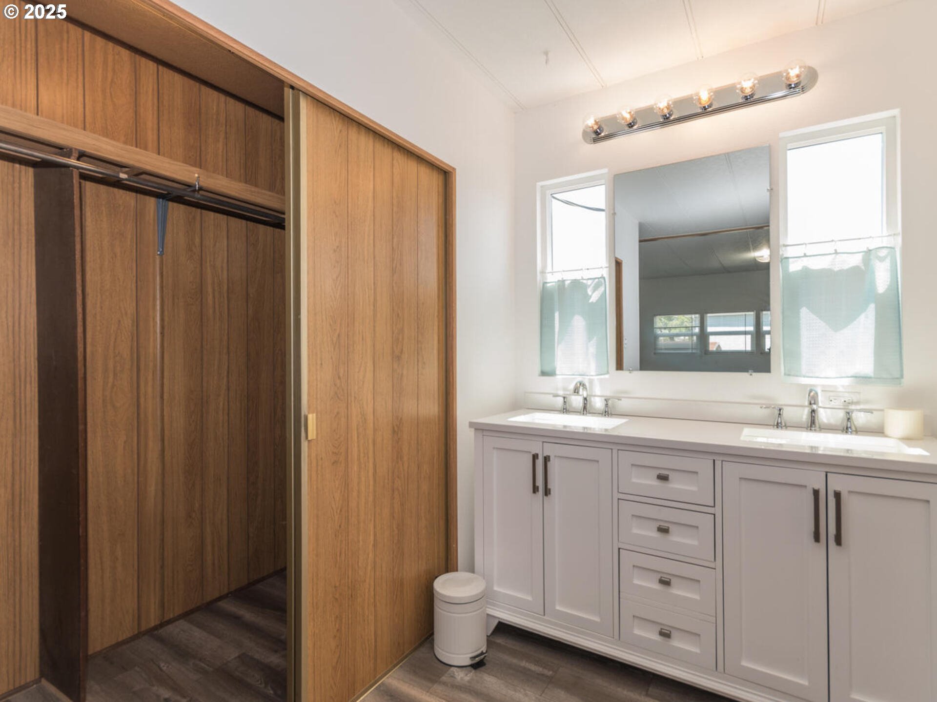 21016 Southeast Stark Street, Unit 69 Gresham, OR 97030 - Photo 33 of 43 a bathroom with a double vanity sink and a mirror