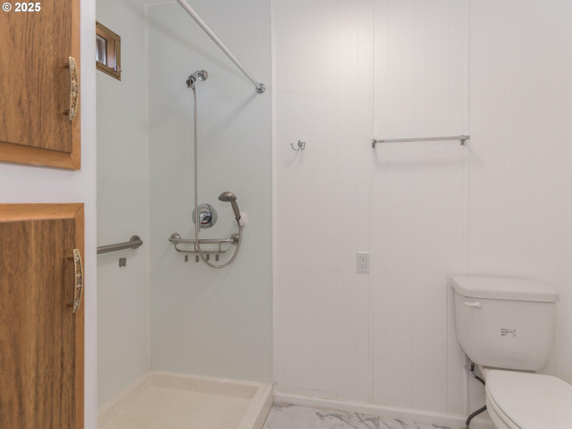 21016 Southeast Stark Street, Unit 69 Gresham, OR 97030 - Photo 34 of 43 a bathroom with a toilet and shower