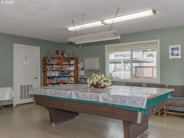 a kitchen with granite countertop a sink stove and cabinets