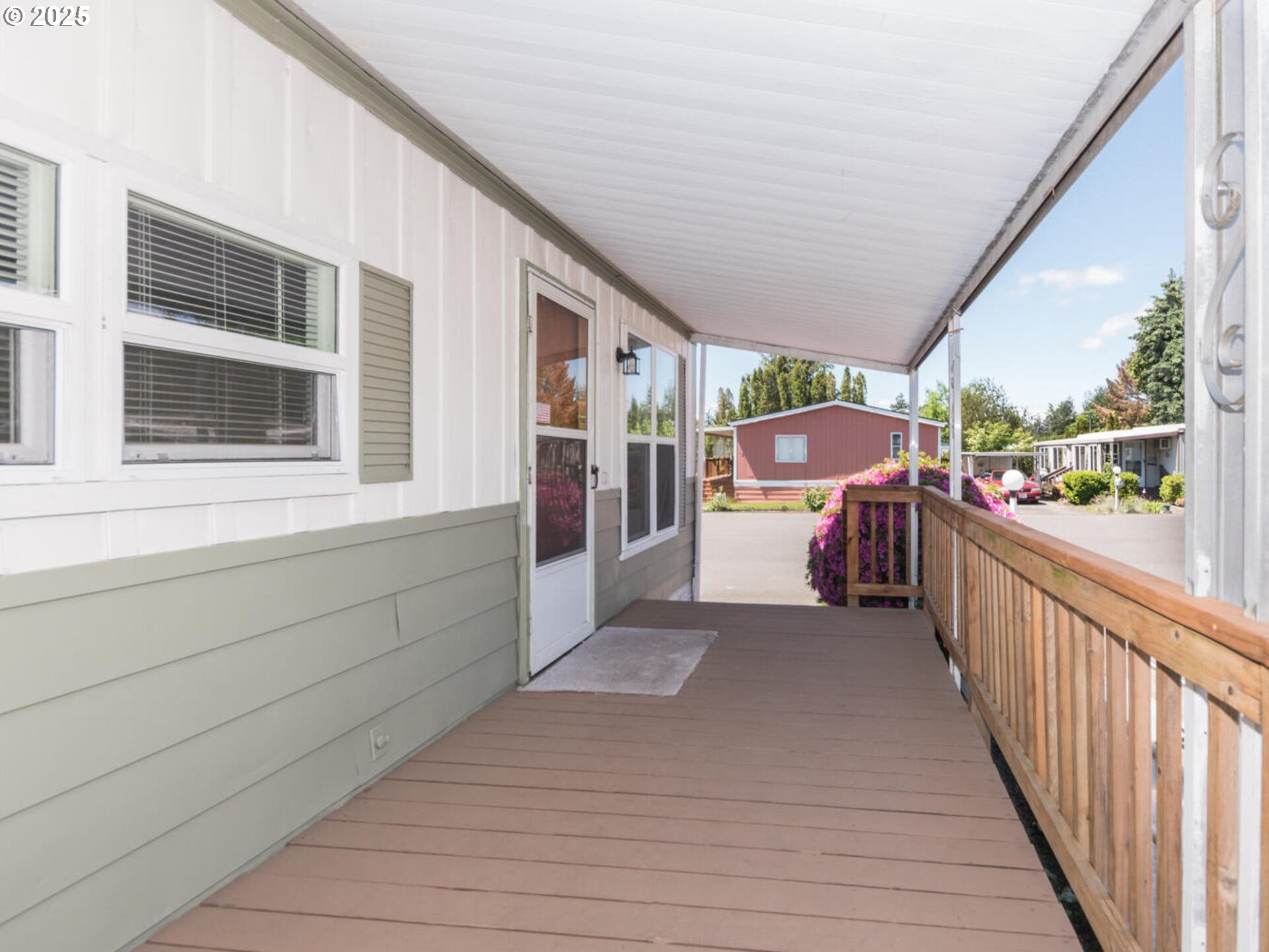 21016 Southeast Stark Street, Unit 69 Gresham, OR 97030 - Photo 10 of 43 a view of a porch with wooden floor and furniture