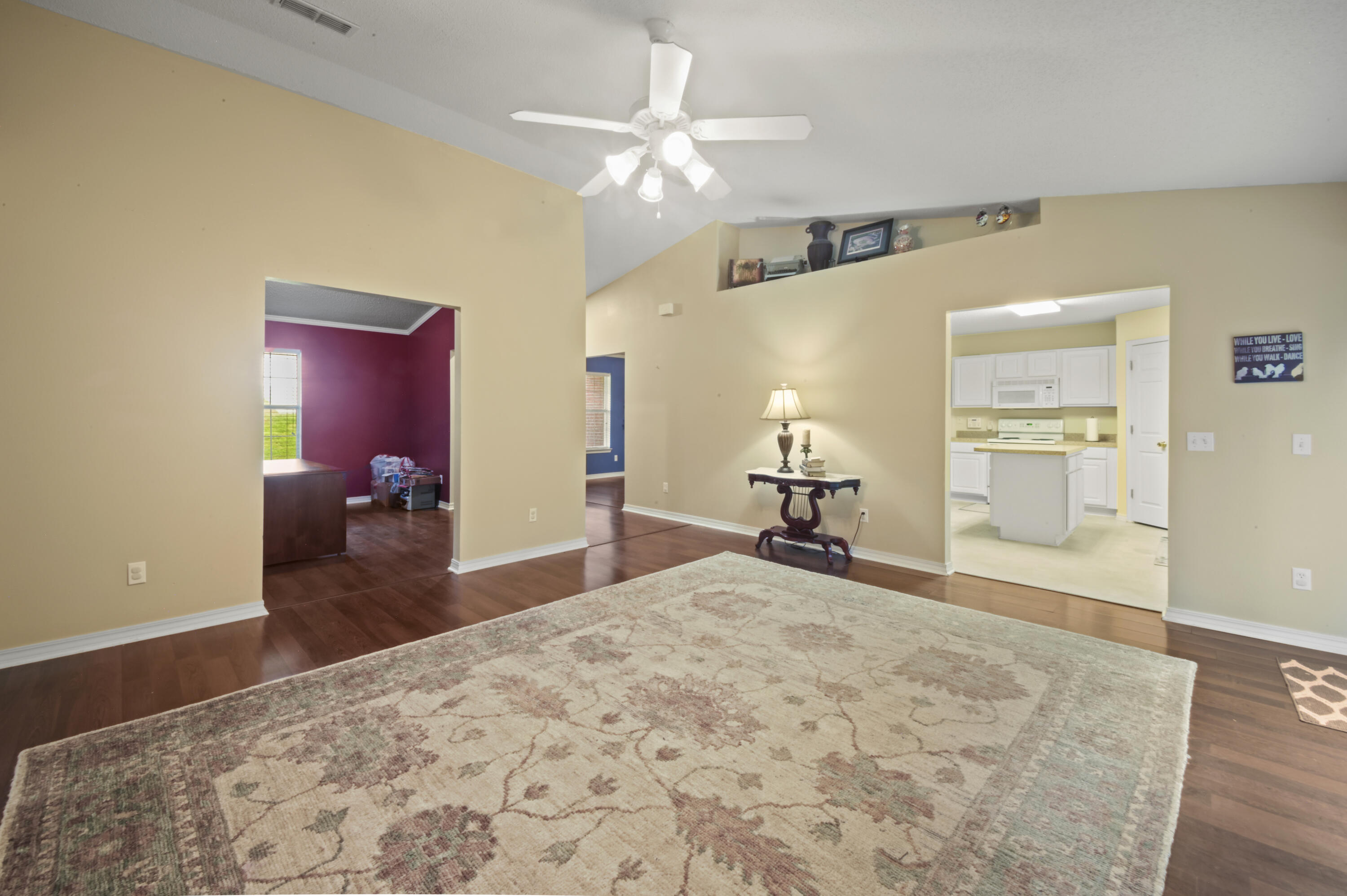 334 Egan Drive Crestview, FL 32536 - Photo 12 of 33 a bedroom with a bed and a chandelier