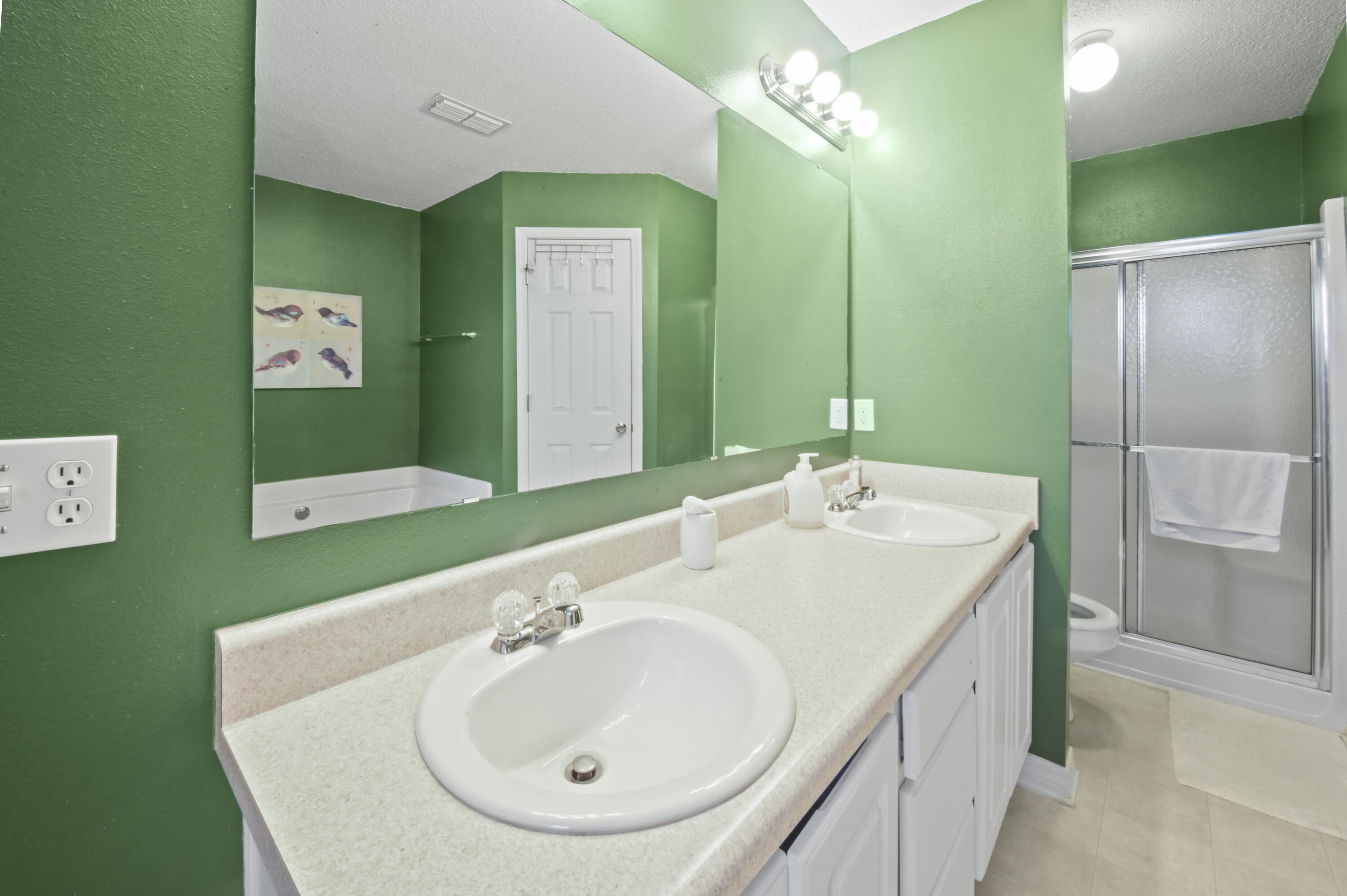 334 Egan Drive Crestview, FL 32536 - Photo 20 of 33 a bathroom with a sink and a mirror