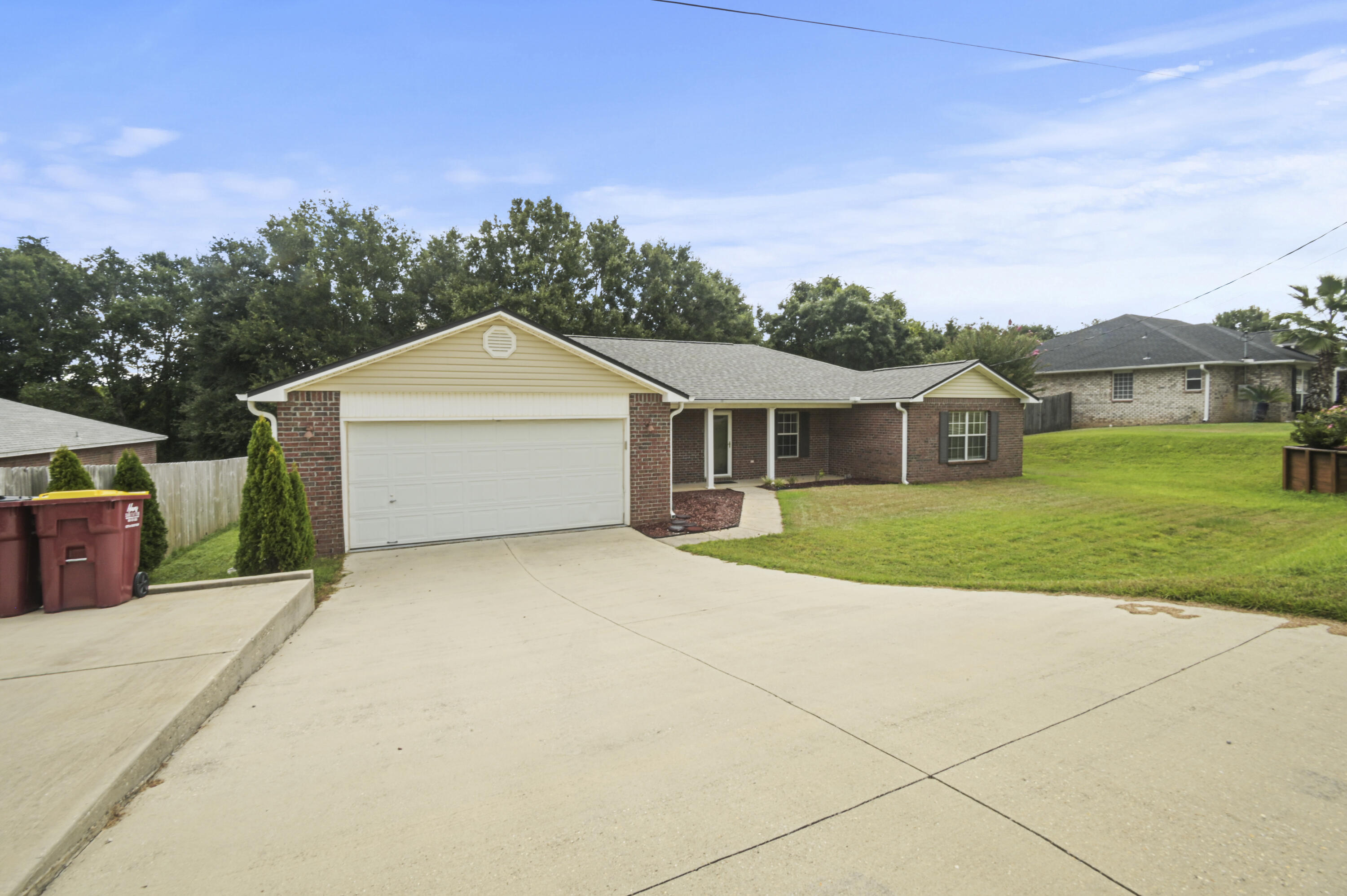 334 Egan Drive Crestview, FL 32536 - Photo 2 of 33 a front view of a house with yard