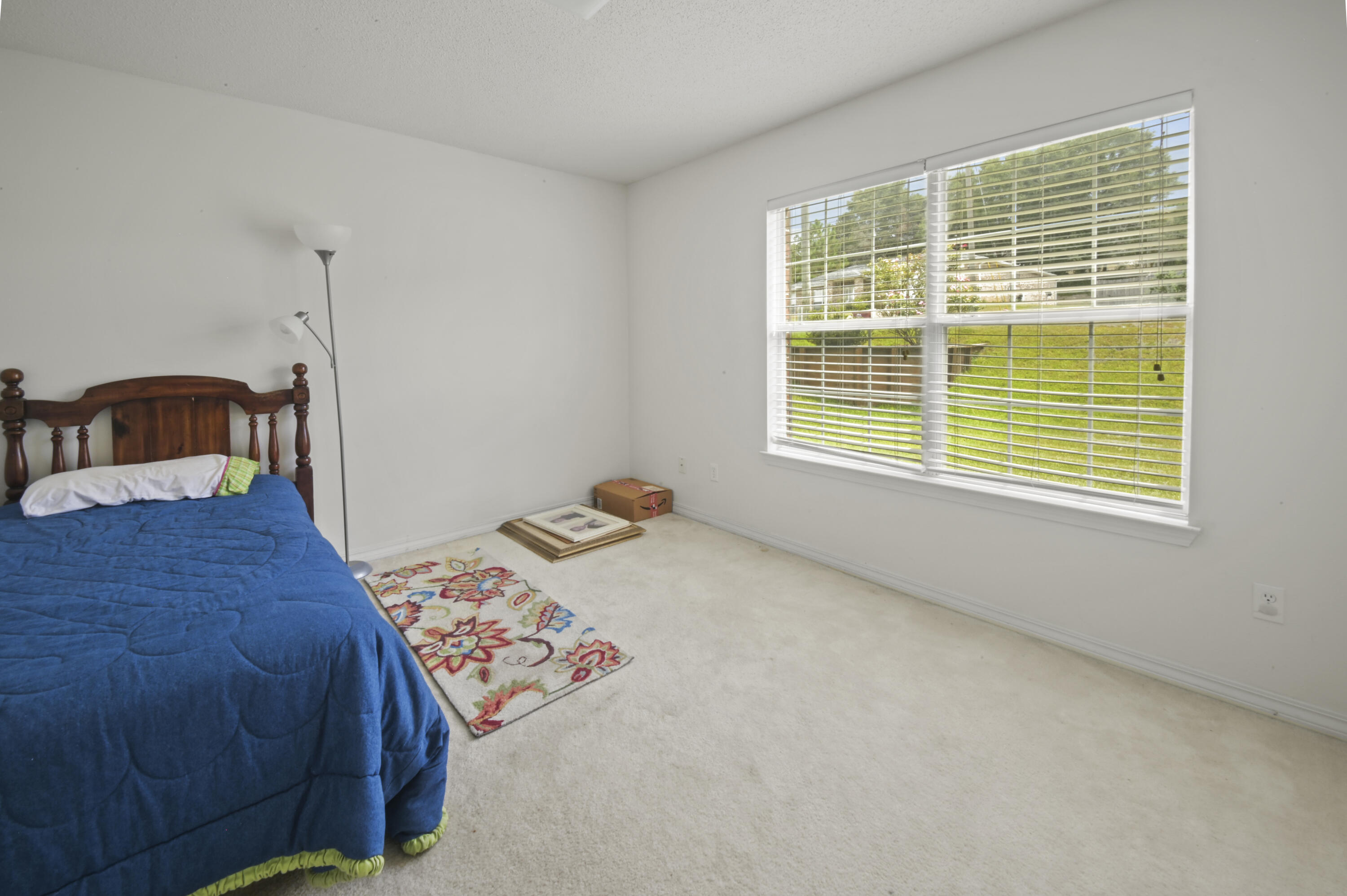 334 Egan Drive Crestview, FL 32536 - Photo 24 of 33 a bedroom with a bed and a window