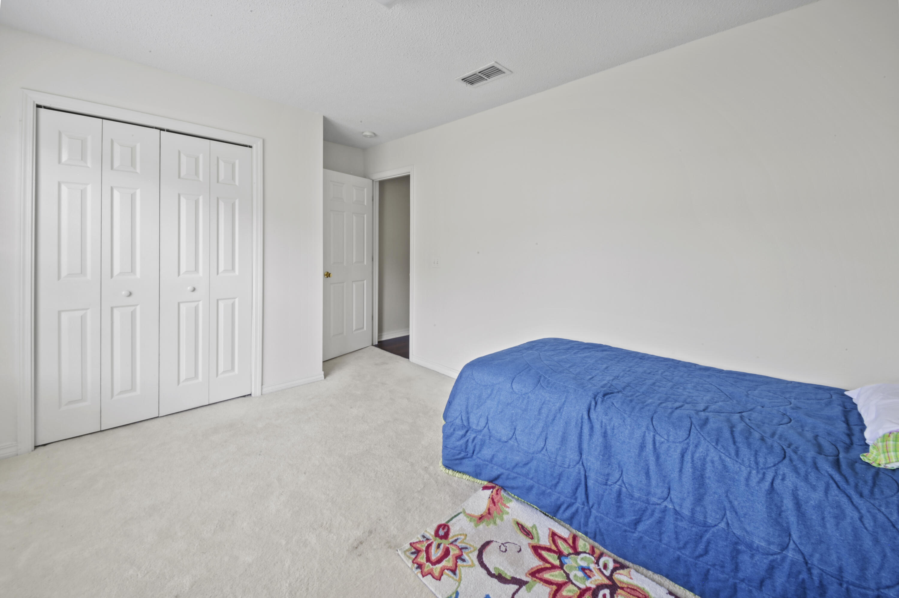 334 Egan Drive Crestview, FL 32536 - Photo 25 of 33 a view of an empty room and wooden floor