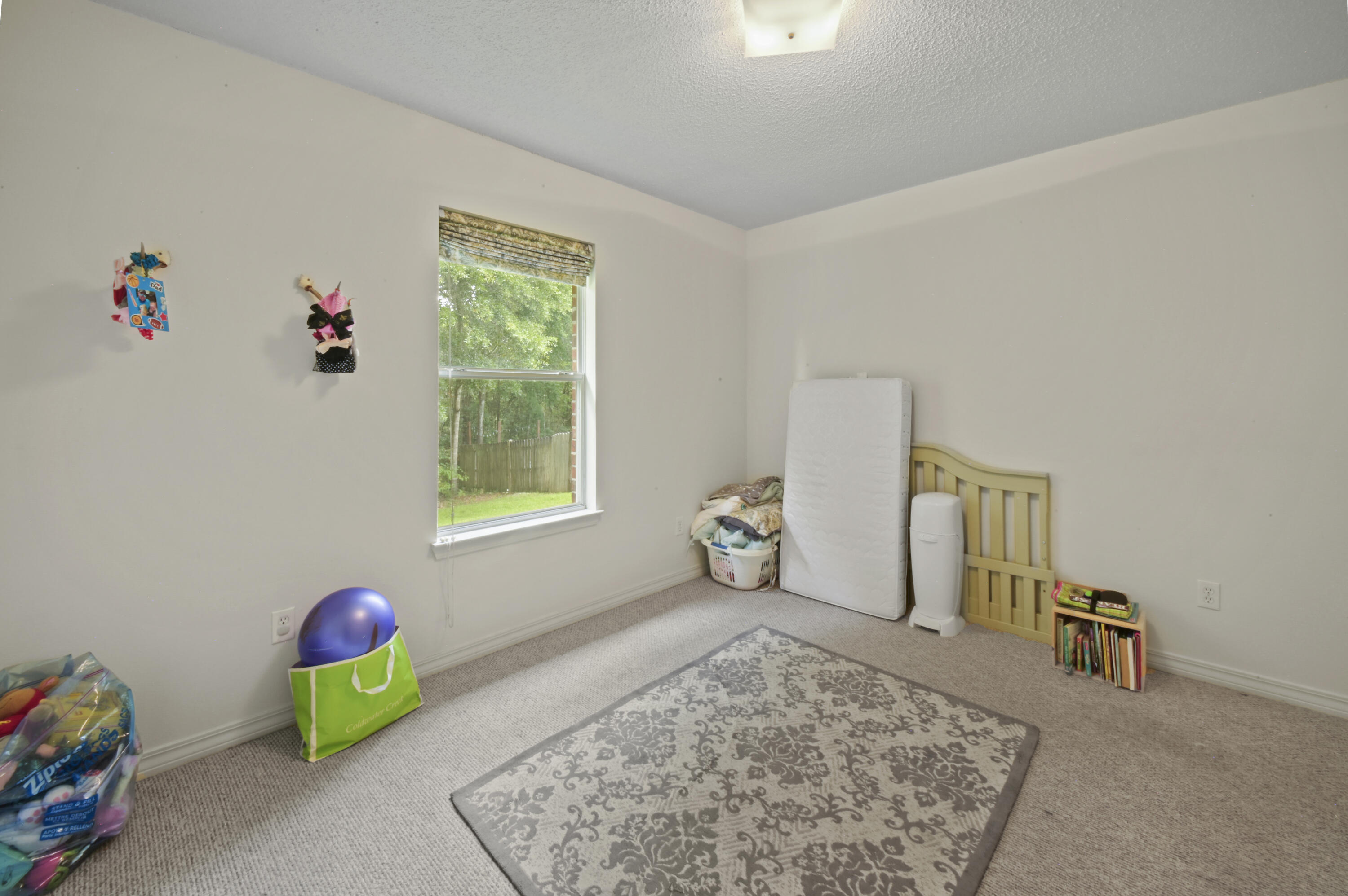 334 Egan Drive Crestview, FL 32536 - Photo 26 of 33 a very nice looking room with a window