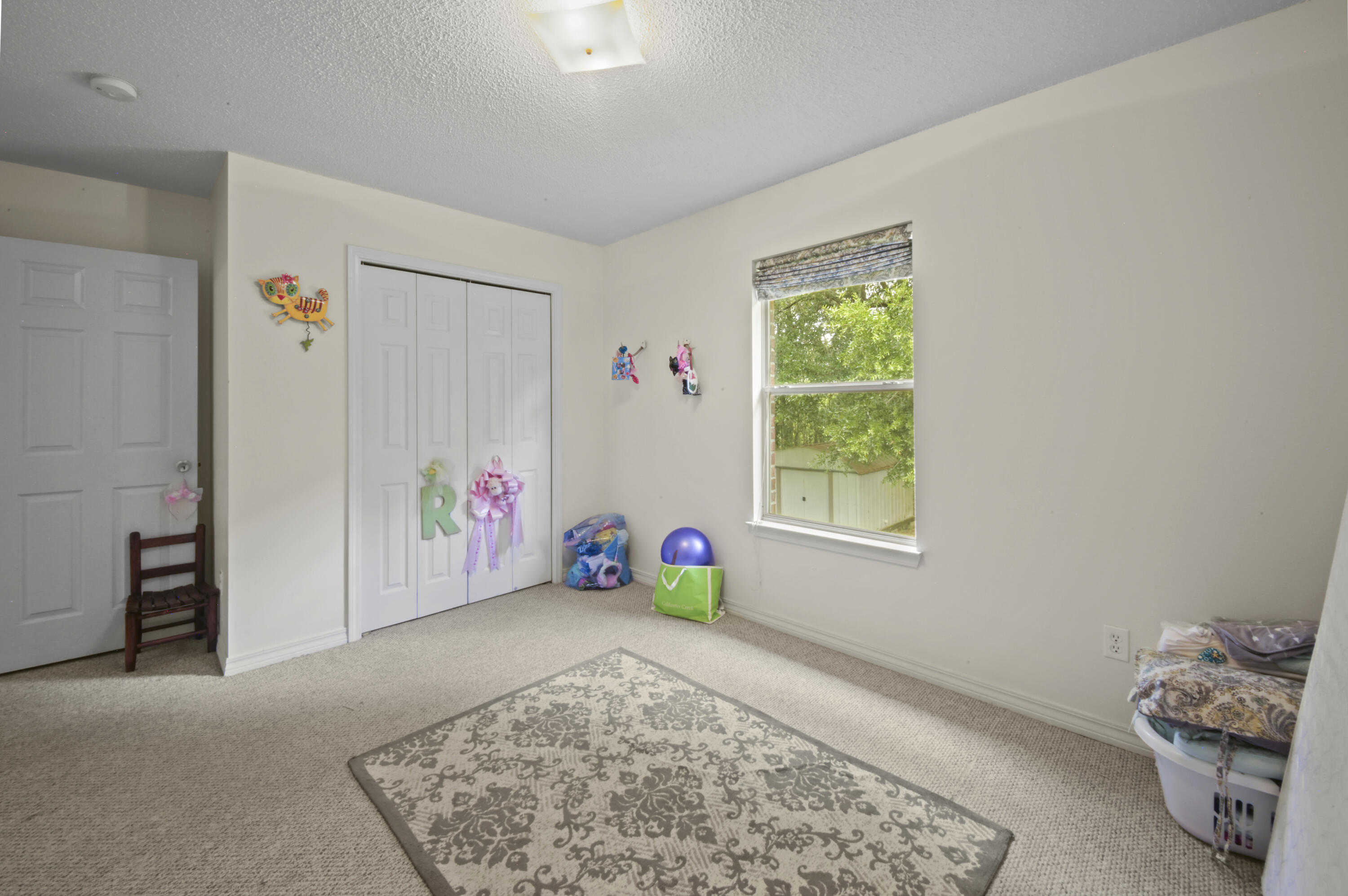 334 Egan Drive Crestview, FL 32536 - Photo 27 of 33 a view of livingroom with furniture and toys