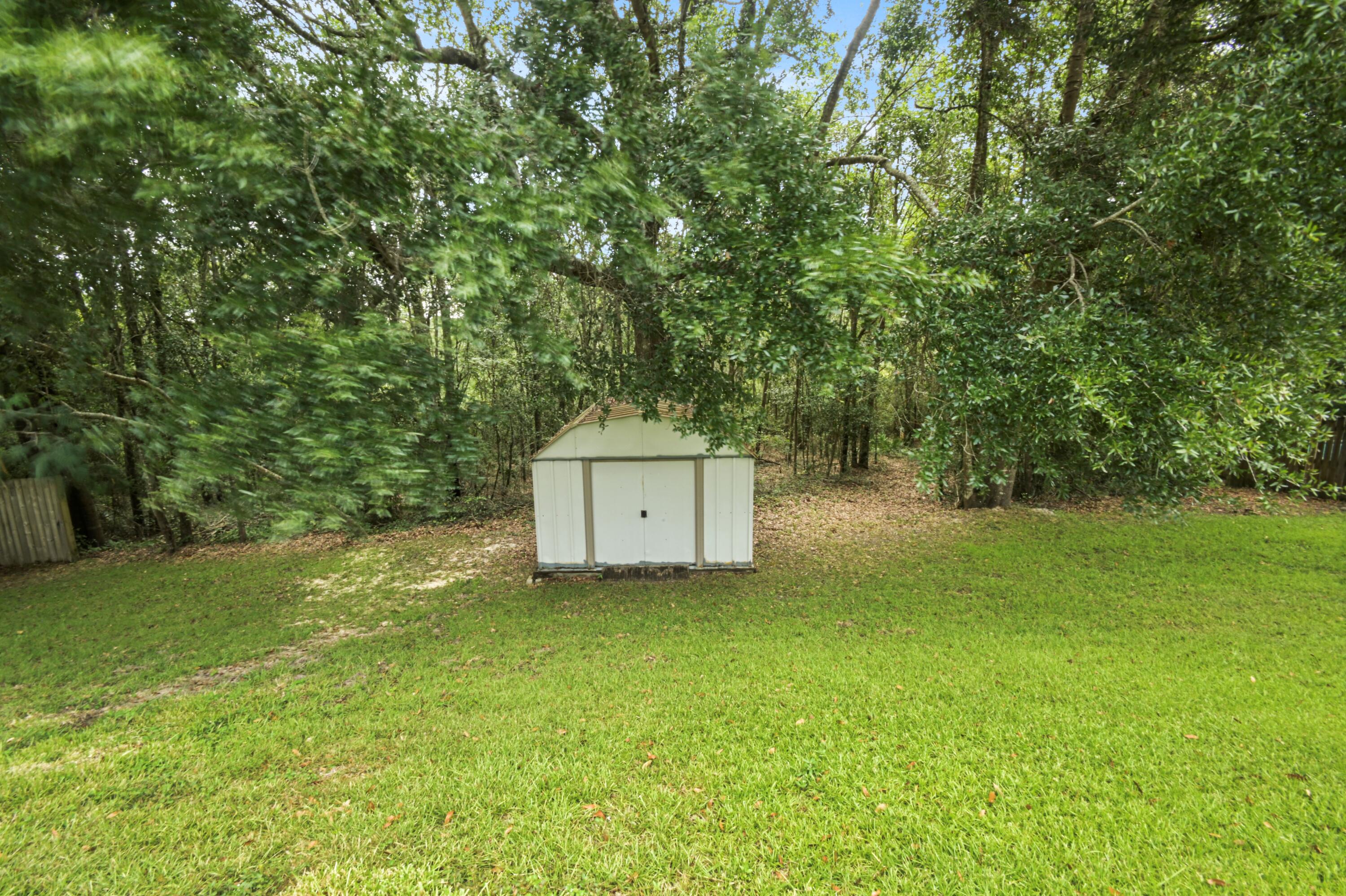 334 Egan Drive Crestview, FL 32536 - Photo 31 of 33 a house with a tree in front of it