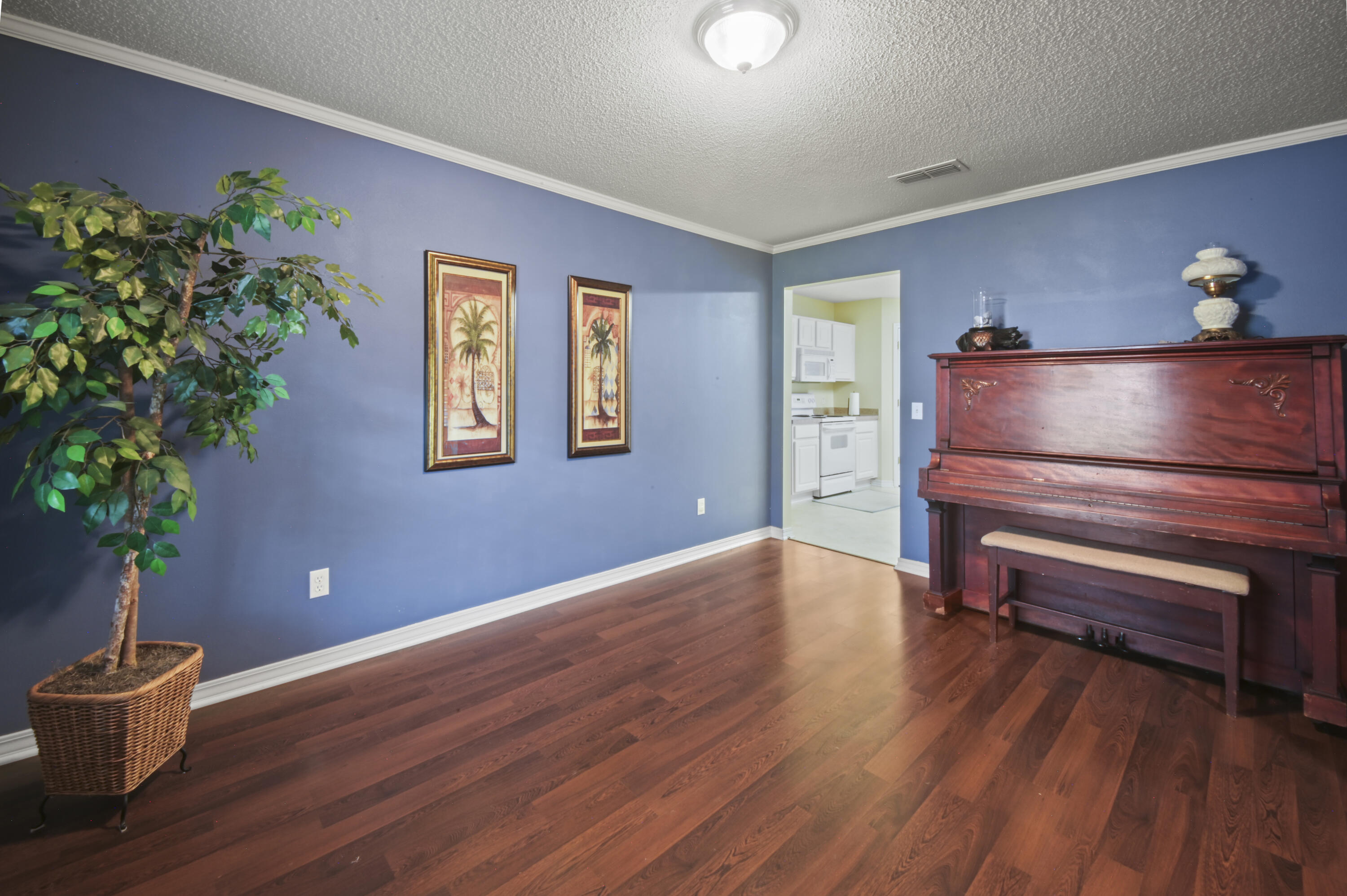 334 Egan Drive Crestview, FL 32536 - Photo 9 of 33 a view of workspace with furniture and wooden floor