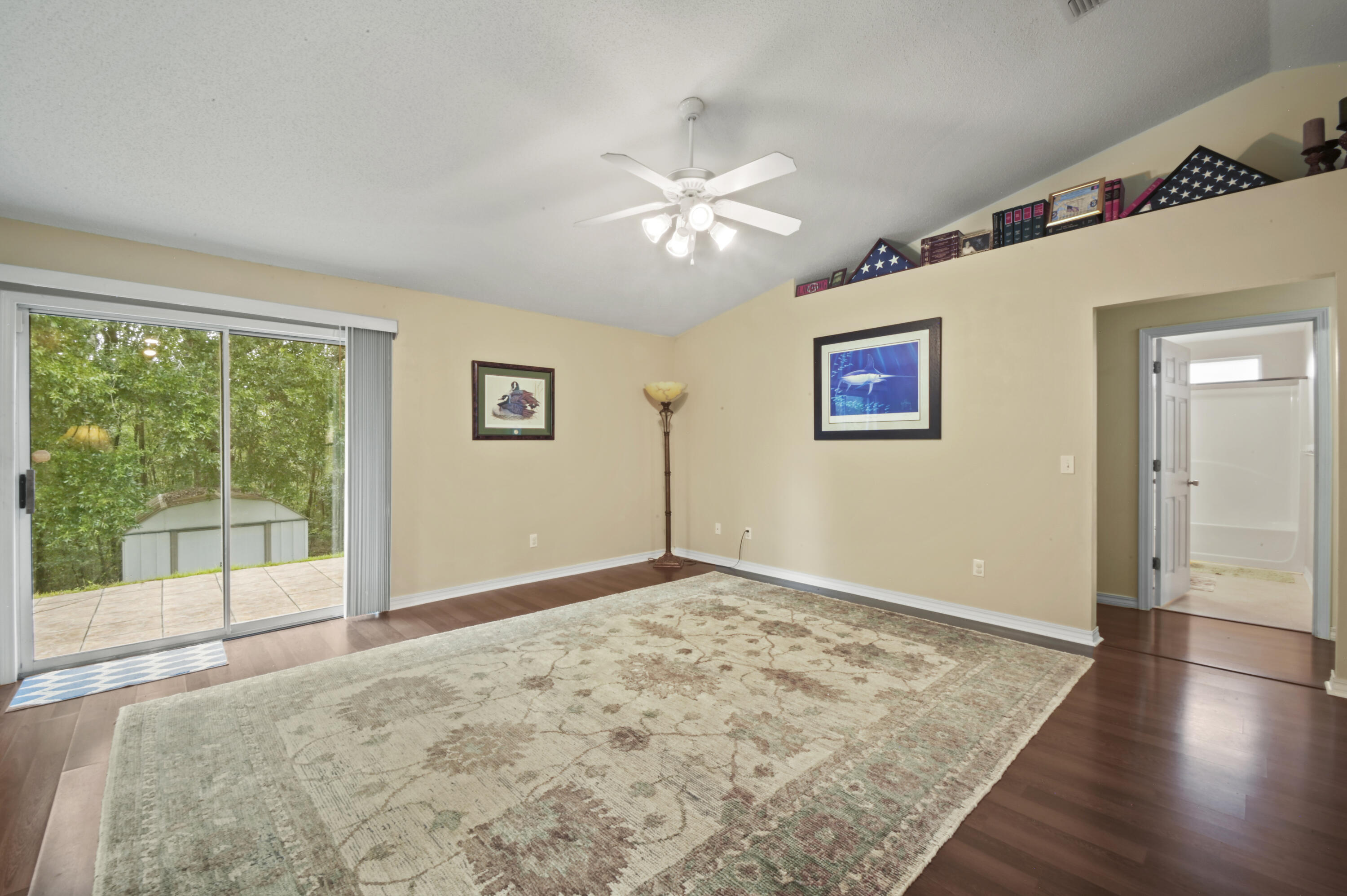 334 Egan Drive Crestview, FL 32536 - Photo 10 of 33 a view of empty room with wooden floor and fan