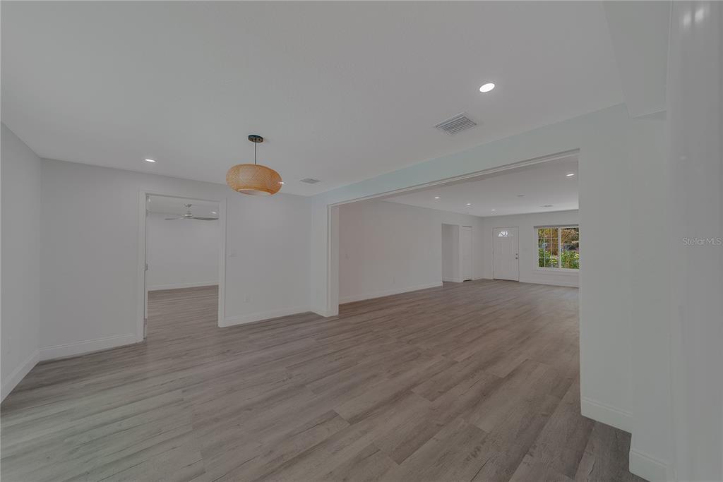 1152 Jackmar Road Dunedin, FL 34698 - Photo 23 of 60 a view of a room with wooden floor and window