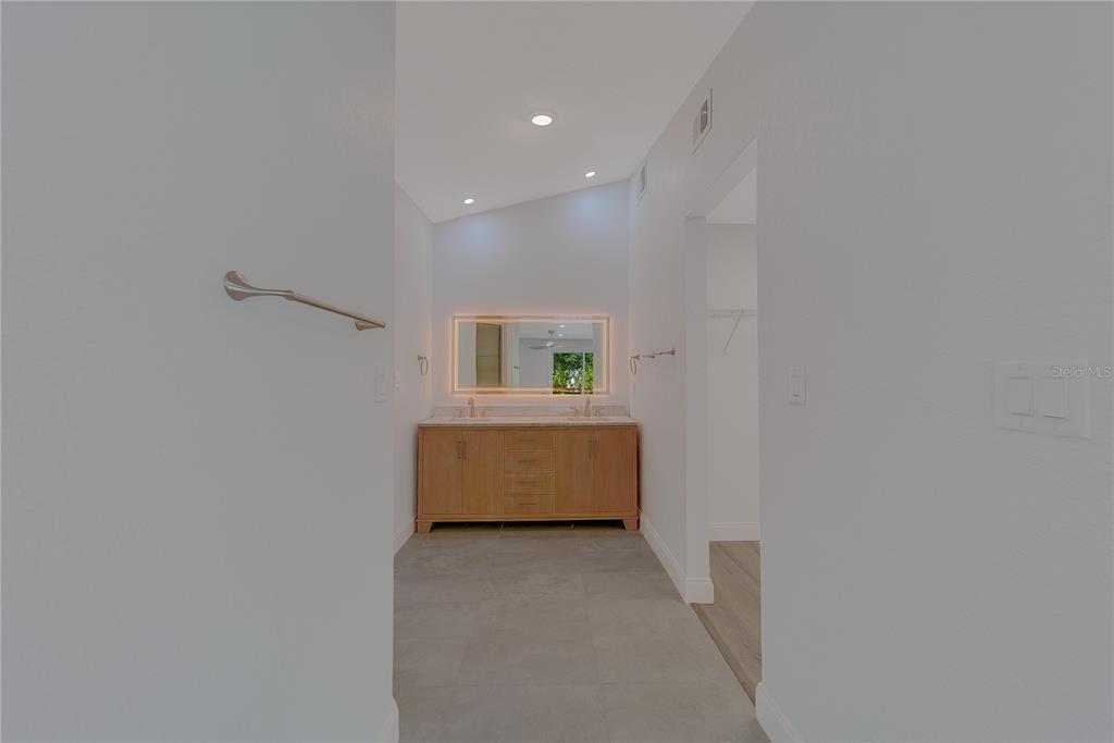 1152 Jackmar Road Dunedin, FL 34698 - Photo 30 of 60 a bathroom with a tub and a window