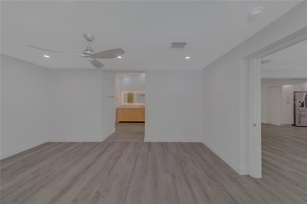 1152 Jackmar Road Dunedin, FL 34698 - Photo 35 of 60 a view of empty room with wooden floor