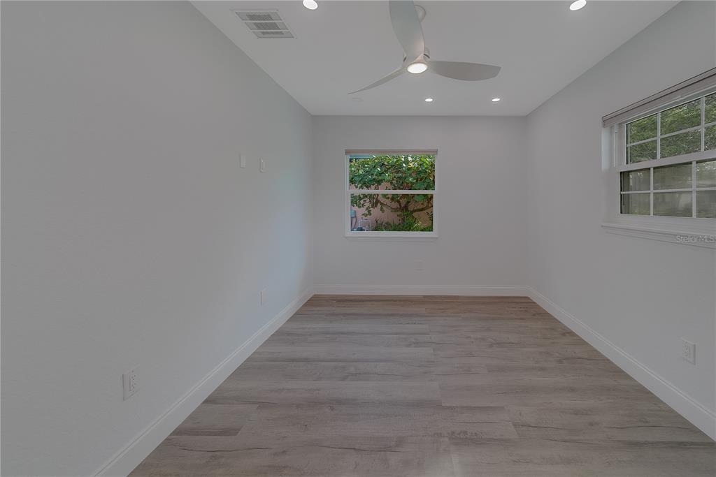 1152 Jackmar Road Dunedin, FL 34698 - Photo 37 of 60 an empty room with windows