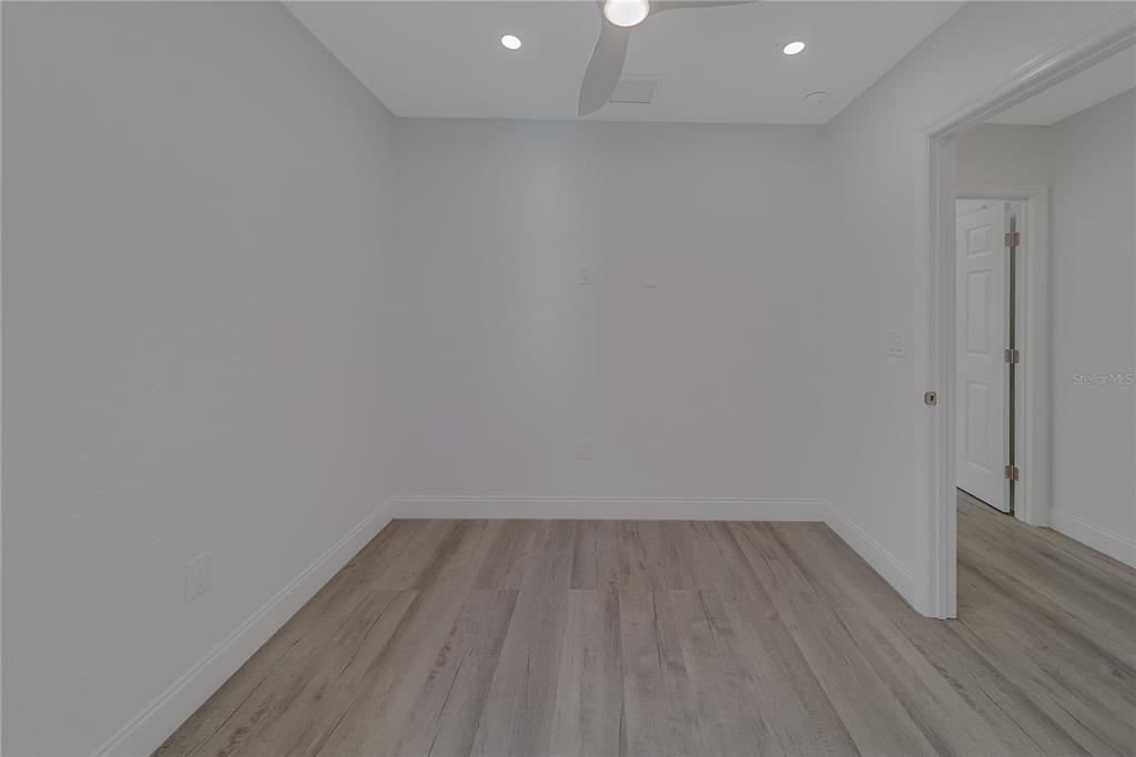 1152 Jackmar Road Dunedin, FL 34698 - Photo 41 of 60 a view of room with wooden floor