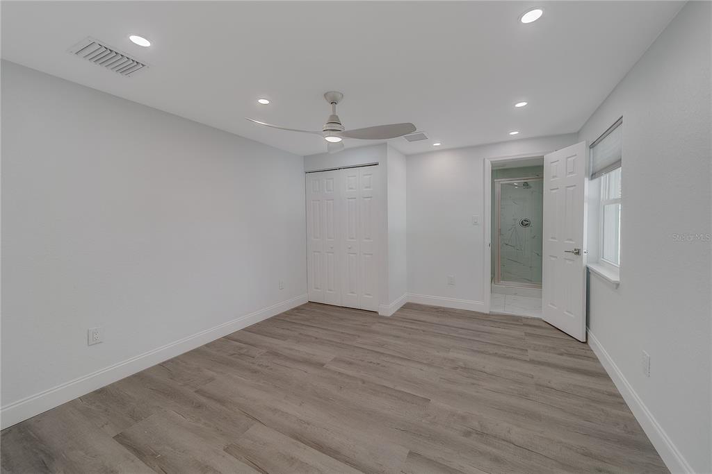 1152 Jackmar Road Dunedin, FL 34698 - Photo 45 of 60 a view of an empty room with wooden floor