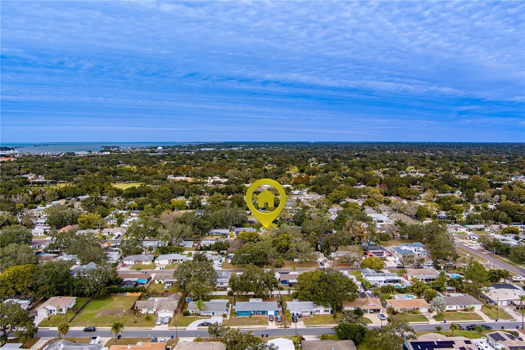 1152 Jackmar Road Dunedin, FL 34698 - Photo 57 of 60 an aerial view of residential building and ocean