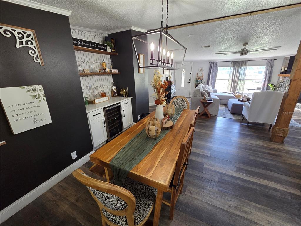 3935 Rambler Avenue St. Cloud, FL 34772 - Photo 12 of 36 a living room with furniture and a chandelier