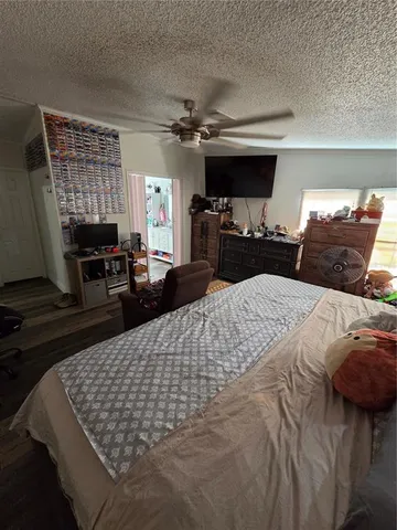 a bed sitting in a bedroom and fireplace