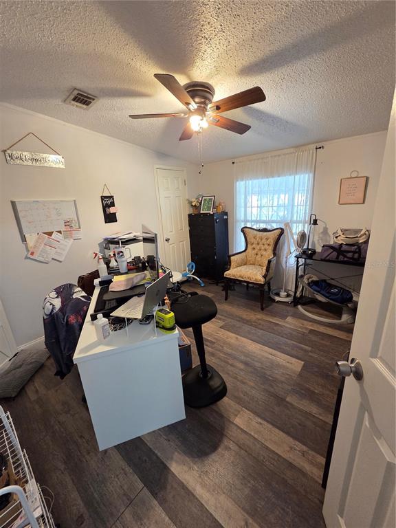 3935 Rambler Avenue St. Cloud, FL 34772 - Photo 26 of 36 a living room with furniture gym equipment and a view of kitchen